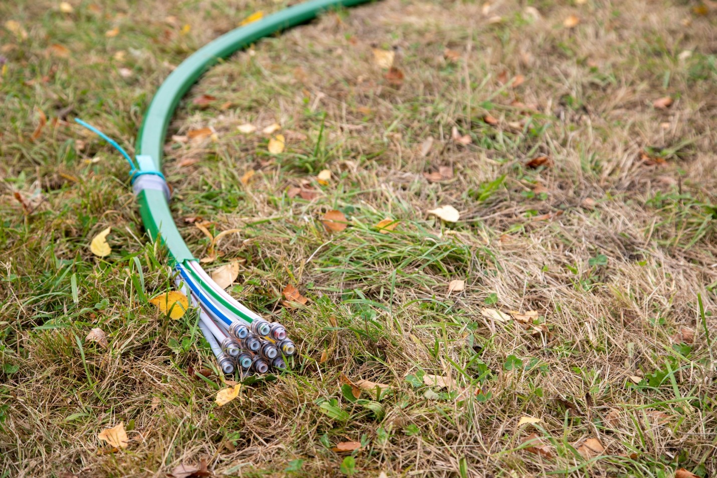 Fiber optic cables laying outside a residential home.