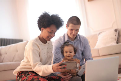 A couple playing with their child