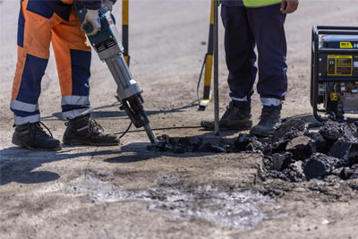 Construction workers putting in a fiber line