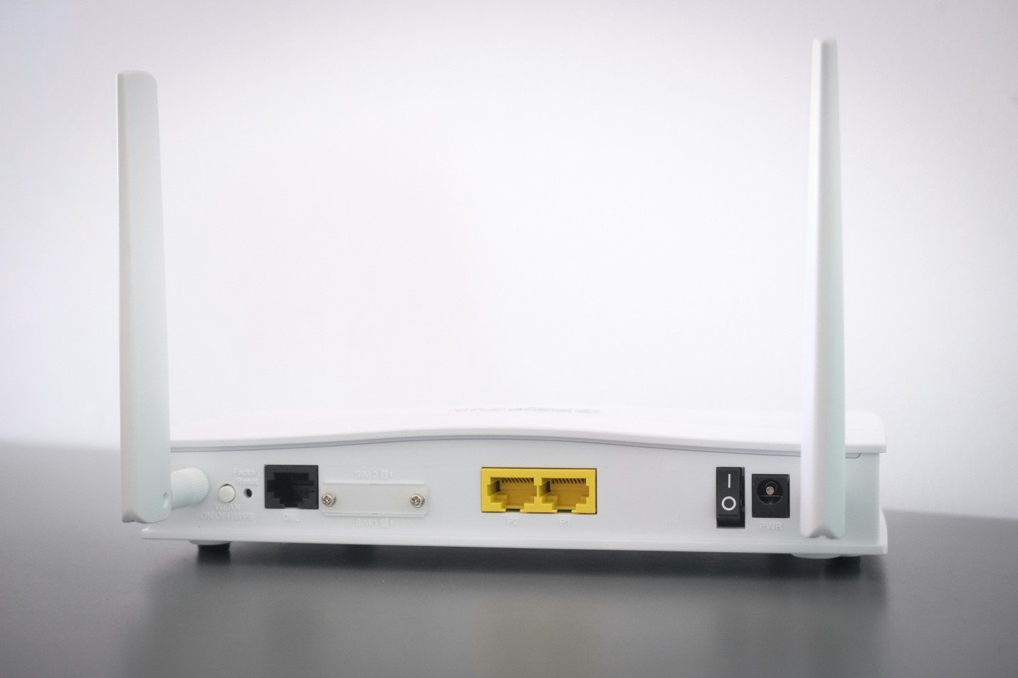 A wireless router without any cables plugged into it. Rebooting a router is often the first troubleshooting tip you’ll hear if you’re having internet issues.