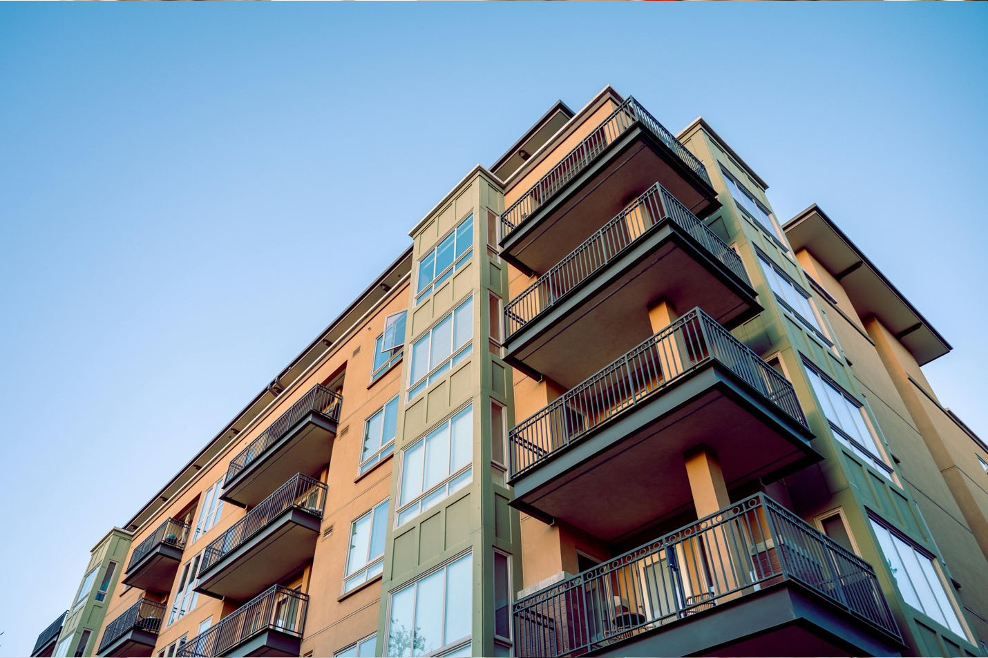 Exterior view of a residential apartment building with multiple units.