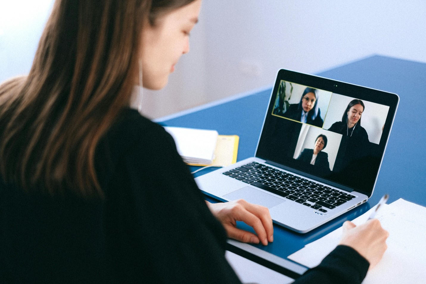 Person using their laptop on a video conference call