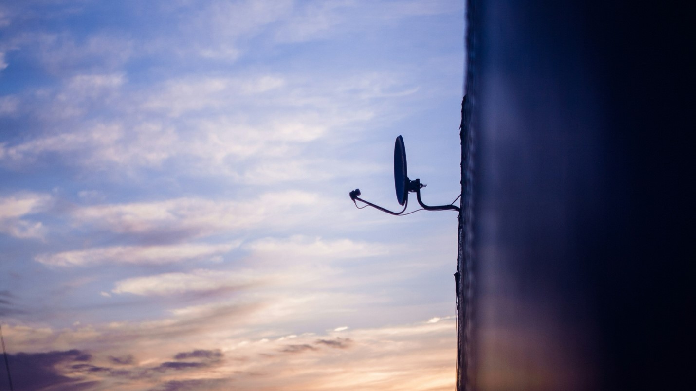 House with a satellite dish installed for satellite internet connection.