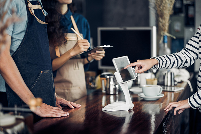 Hillsboro Small Business using internet to receive a digital payment at checkout counter