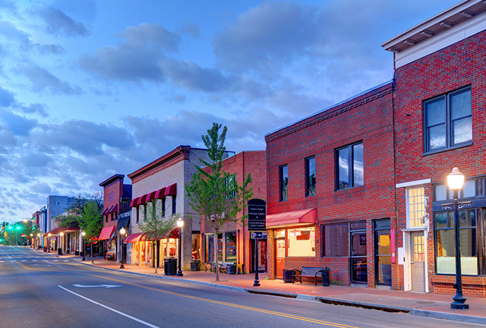 A street lined with brick buildings in downtown Blacksburg, VA