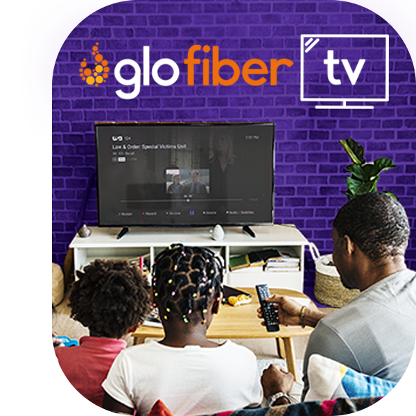 A man streaming Glo Fiber TV with a remote in his hand.